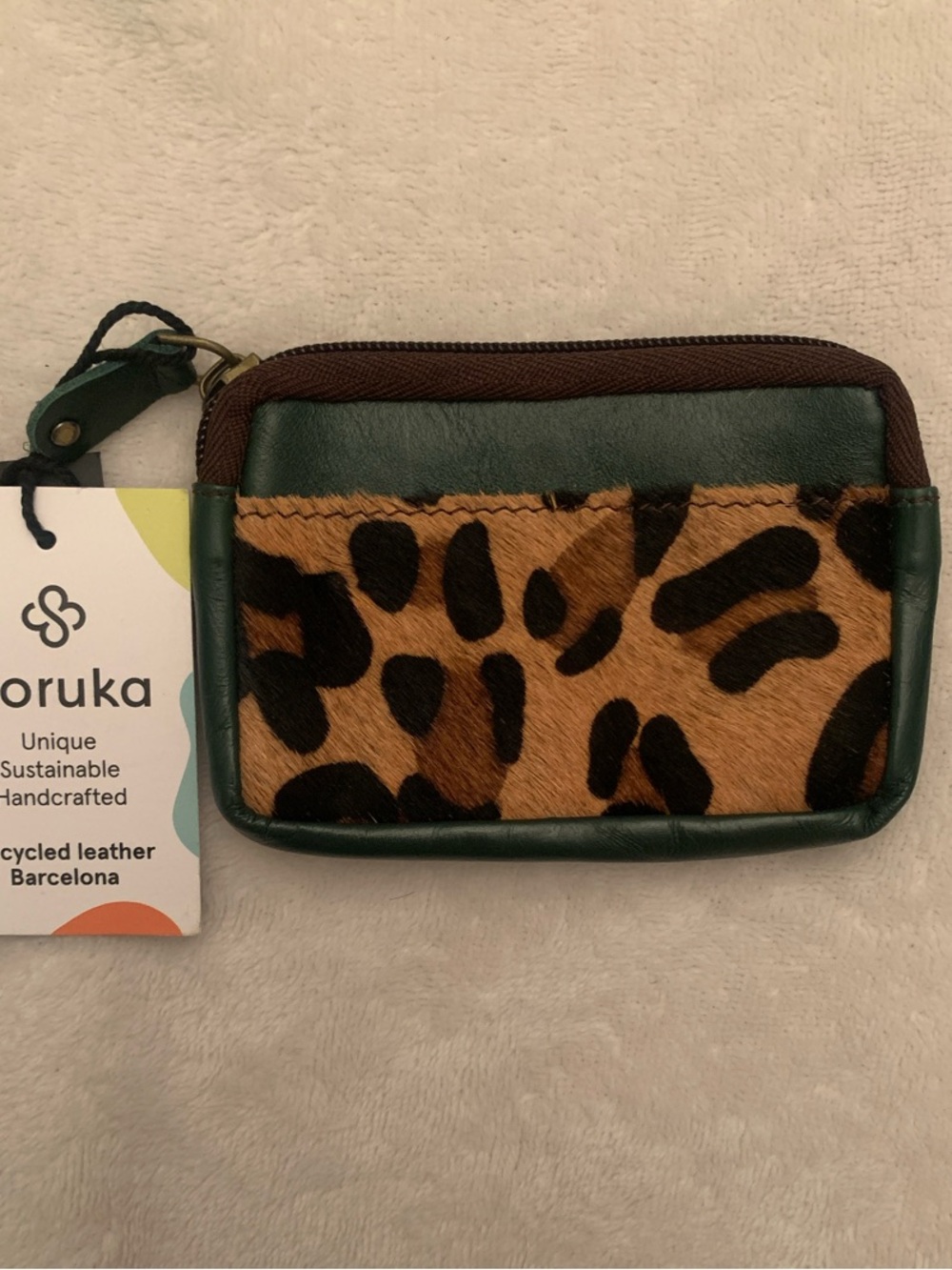 Soruka recycled leathercheetah print and dark green wallet.